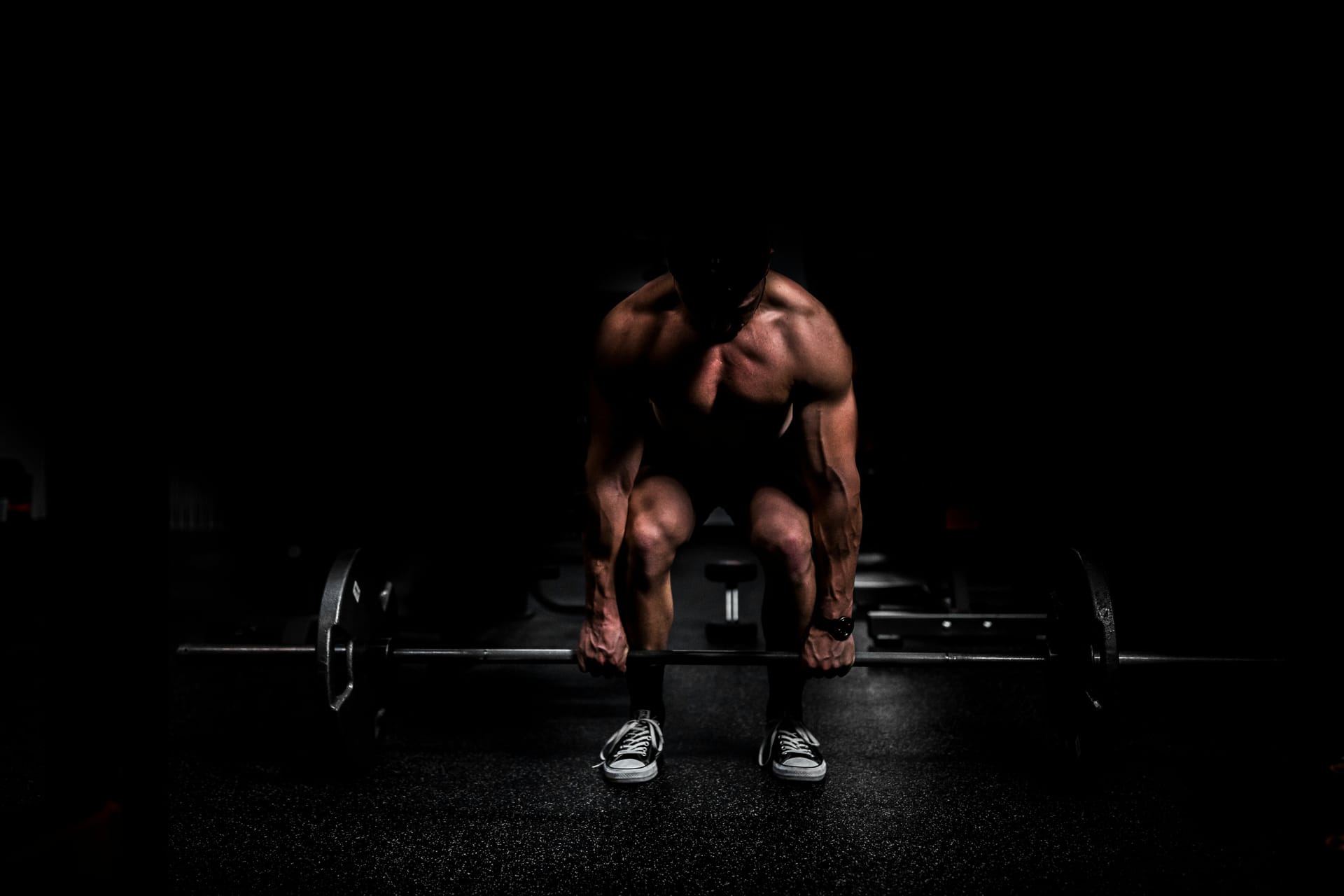 Person lifting weights in gym